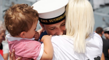 A sailor is reunited with his family after a long deployment with HMS Sutherland overseas.