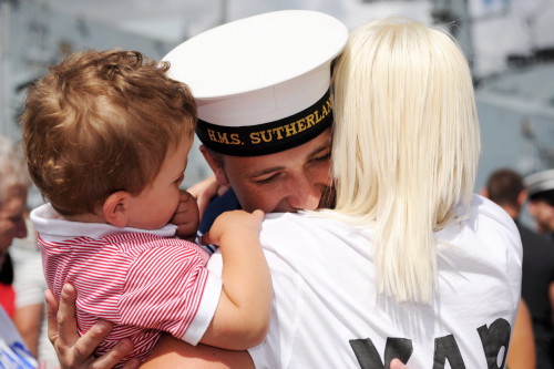 A sailor is reunited with his family after a long deployment with HMS Sutherland overseas.