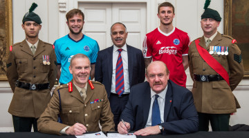 L to R Lance Corporal Frankie McCabe, jake Gallagher, Shahid Azeem, Sean McGinty Sgt Alan Roberts. Major General John Crackett and Brian Barwick. The National League, the competition which covers the fifth and sixth tiers of football in England & Wales, has joined an ever growing list of leading companies and organisations in signing the Armed Forces Corporate Covenant.