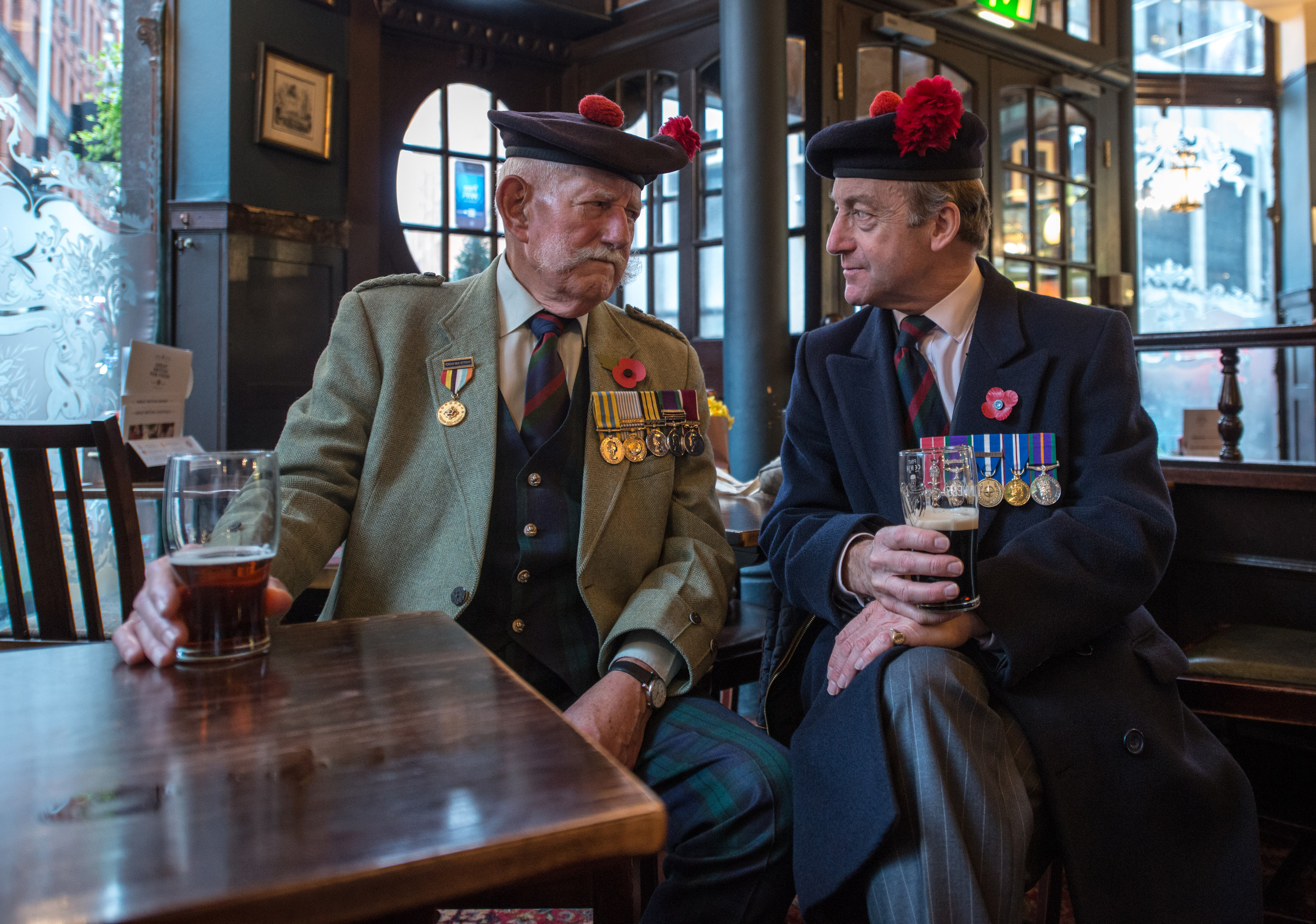 Veterans Joe Hubble and Tim Cole from the Black Watch Association catch up for a swift pint.