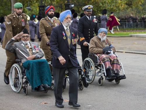 Image shows Indian veterans making their way through Horse Guards.