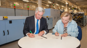 The Secretary State of Defence Rt Hon. Michael Fallon MP and Royal Mail CEO Moya Greene signing Royal Mail’s Armed Forces Covenant at Mount Pleasant Mail Centre in London
