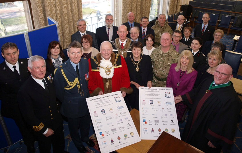 Partners across Wrexham signing the Armed Forces Covenant in April 2013