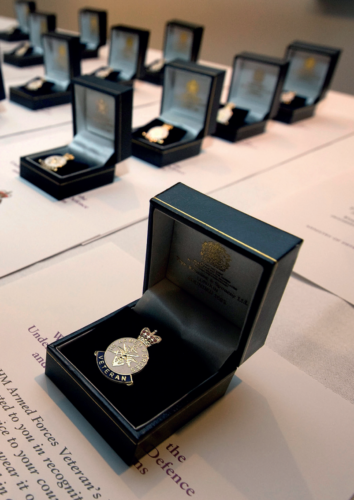 a small box with a cuff link for veterans. 