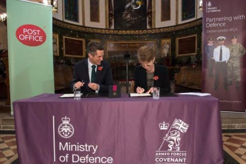 Former Defence Secretary, Gavin Williamson and Post Office CEO signing the Armed Forces Covenant. 